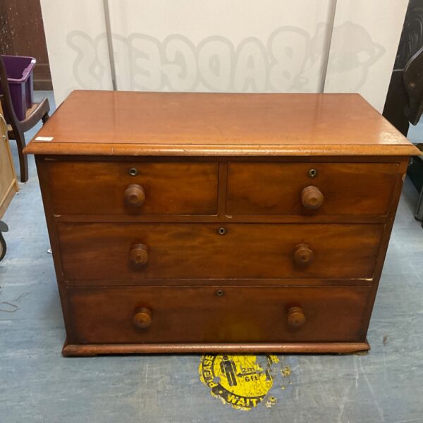 Antique mahogany chest of drawers with 2 over 3 configuration.