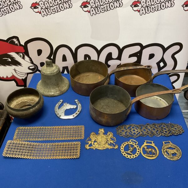 Antique metalware lot featuring bell and copper pans.
