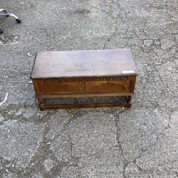 Antique oak coffer with carved detailing, vintage storage chest.