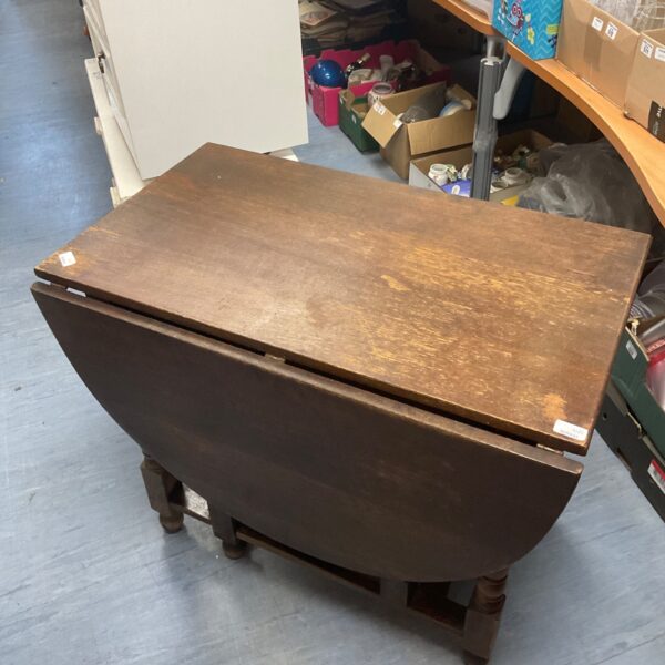 Antique oak gate leg table with drop leaves, vintage furniture.