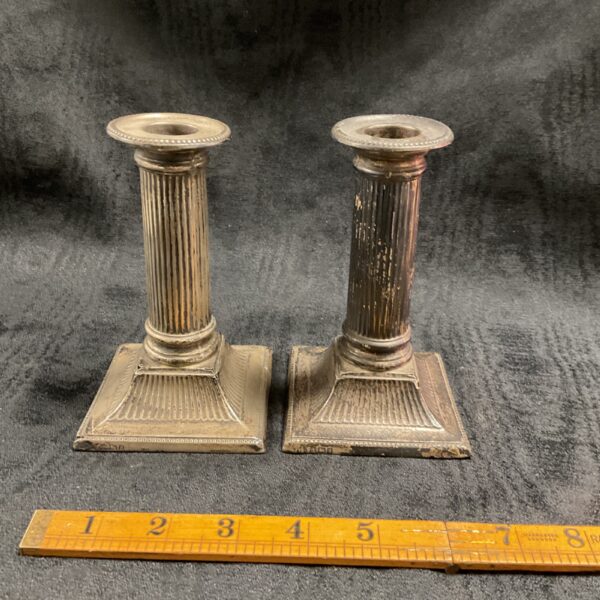 Antique silver column candlesticks, a hallmarked weighted pair.