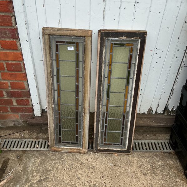Antique stained glass windows with geometric leadlight design.