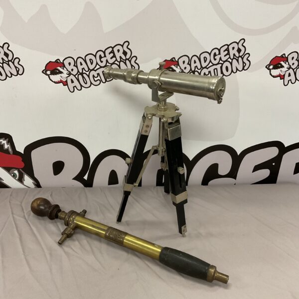 Antique brass telescope on tripod with Eclipse No1 sprayer.