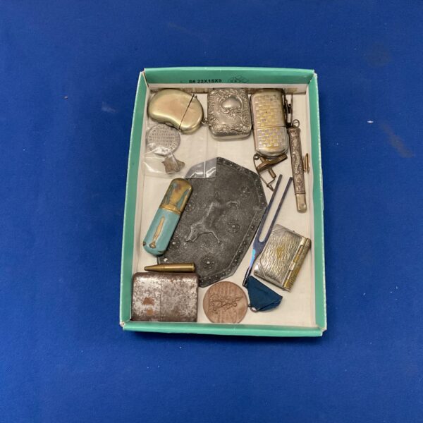 Antique vesta cases and shatlaiene pencils in a collectible lot.
