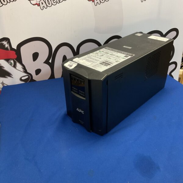 APC Smart UPS 1500 power supply unit for computer protection.