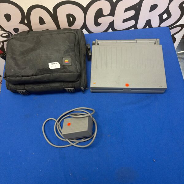 Vintage Apple PowerBook 100 laptop in grey plastic casing.