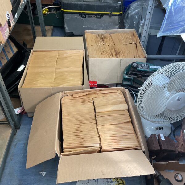 Three boxes of arofol classic postal packs for mailing.