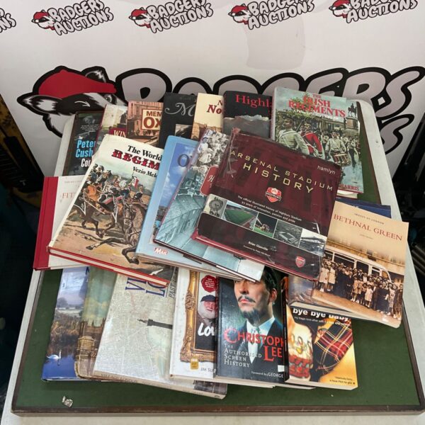 Collection of vintage Arsenal and Irish Regiment books for collectors.