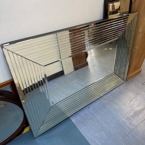 Large vintage Art Deco mirror with geometric stepped design.