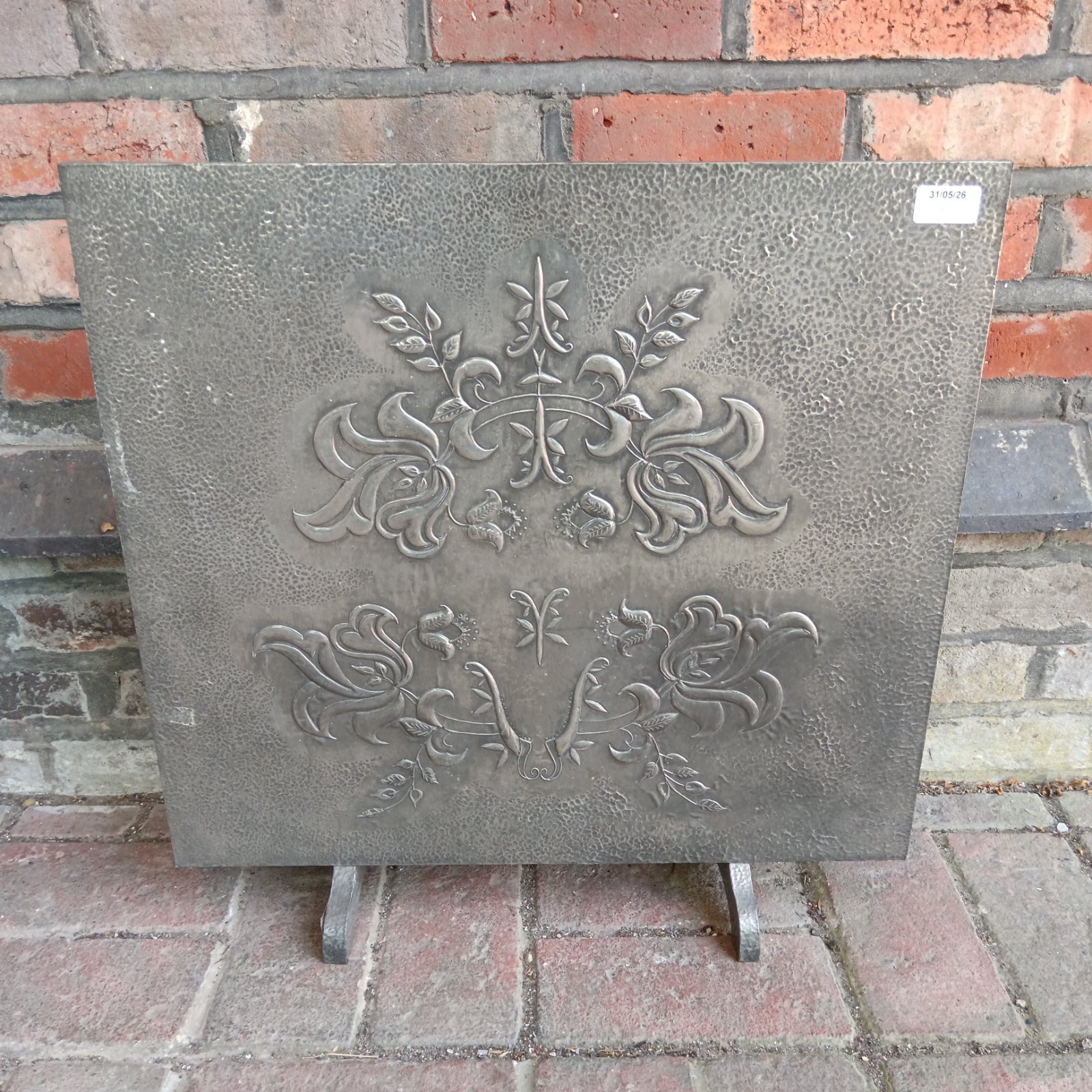 Antique Art Nouveau pewter fire guard with floral embossed design.