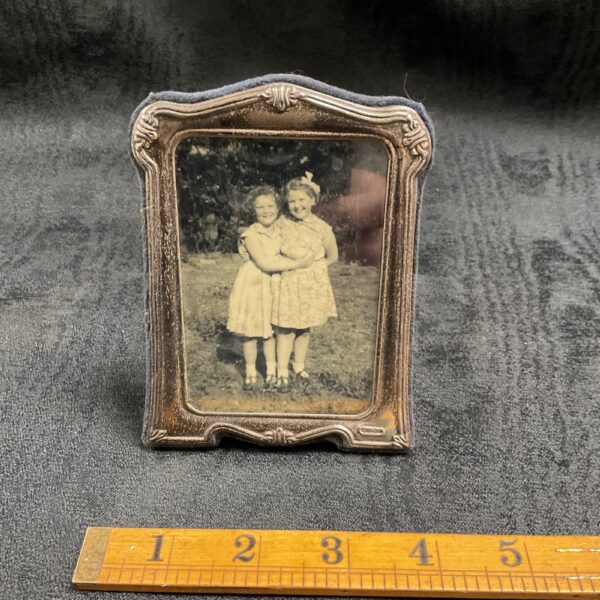 Antique Art Nouveau silver photo frame with vintage photograph.