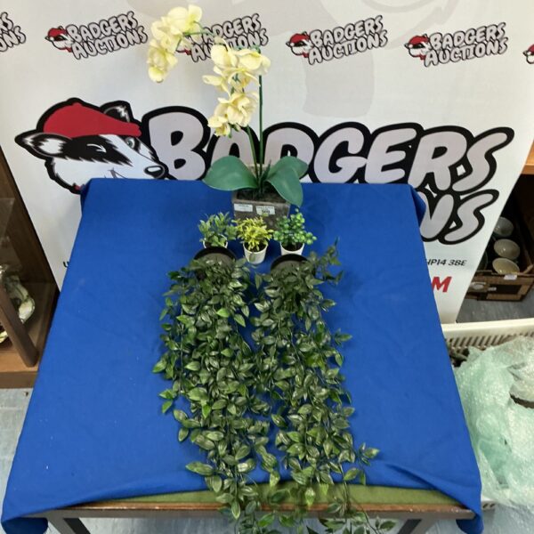 Arrangement of artificial house plants for home decor.