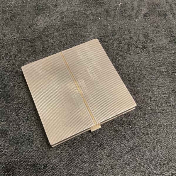 Vintage silver Asprey ladies compact with ribbed design.