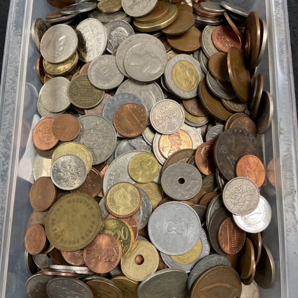 Close-up of a large lot of assorted vintage coins.