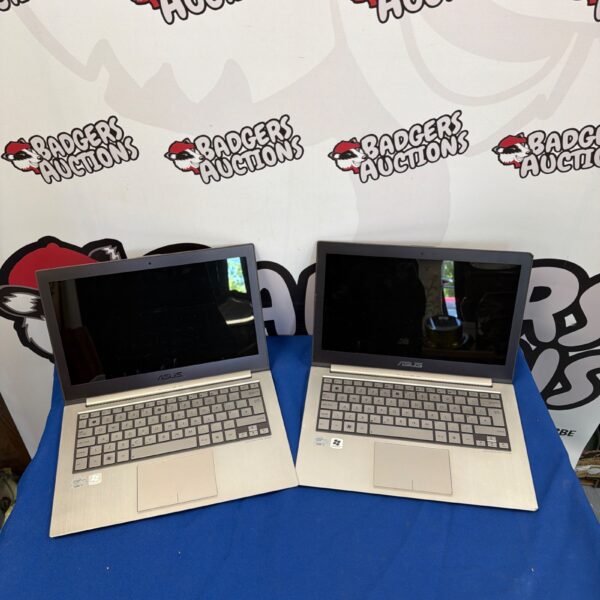 Lot of two used ASUS laptops for repair or parts.