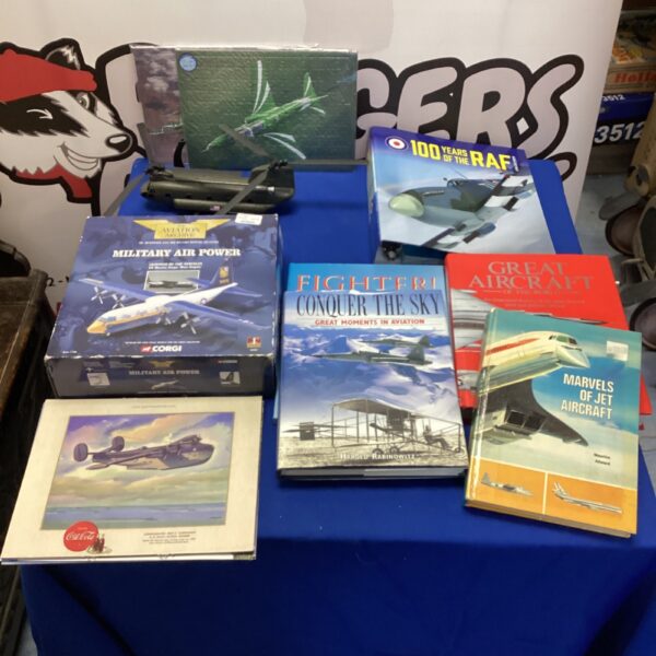 Aviation books and a Chinook model in a collectible bundle.