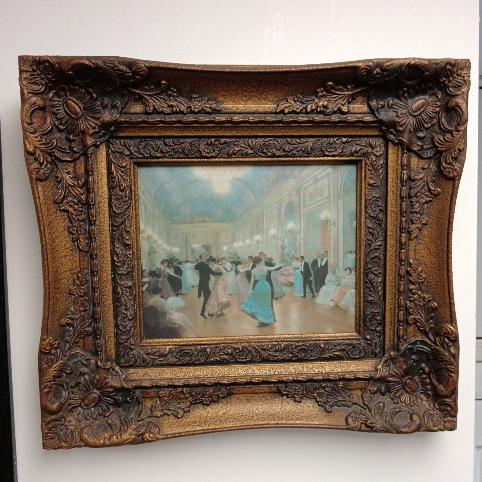 Ornate framed print of a Victorian ballroom dance scene.
