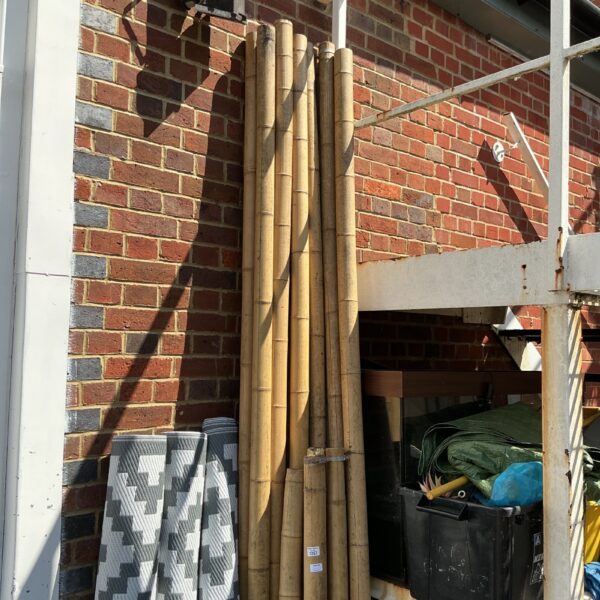 Quantity of natural bamboo poles for garden and DIY projects.