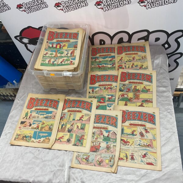 Box of vintage Beezer comics, a classic British humour magazine.