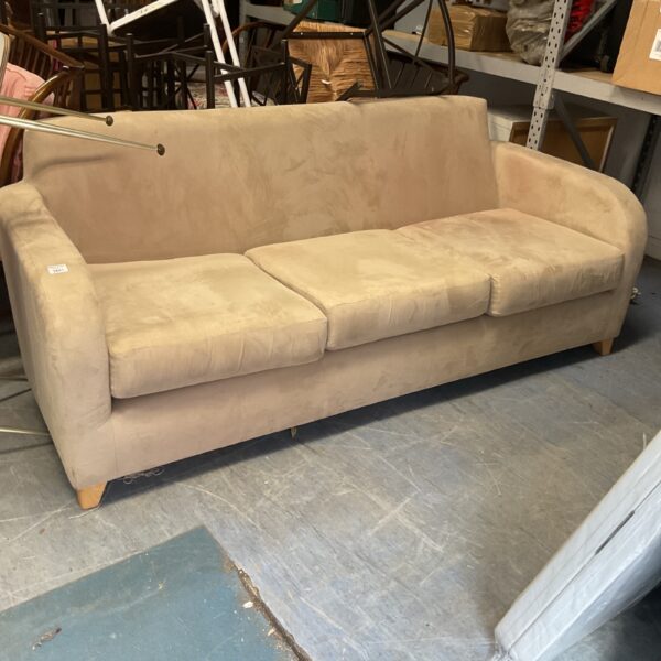 Beige suede 3-seater sofa with curved arms and wooden legs.