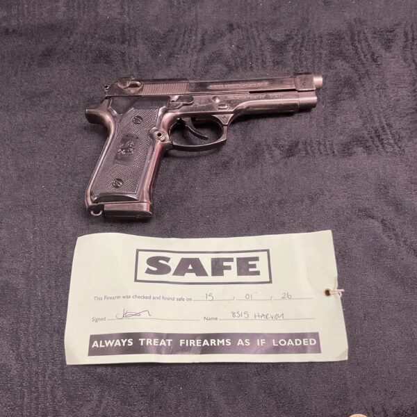 Beretta replica pistol gas lighter with safe label.