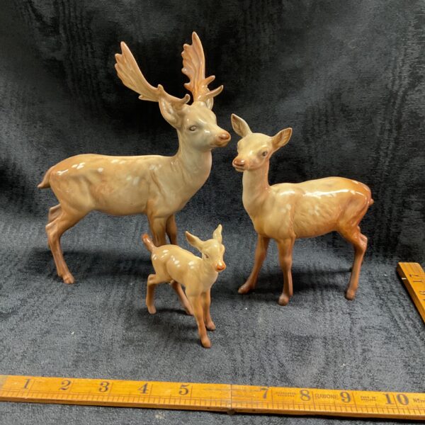 Vintage Beswick stag, doe, and fawn ceramic figures, collectible pottery.