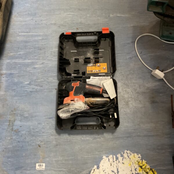 Black and Decker 18V cordless detail sander in its case.