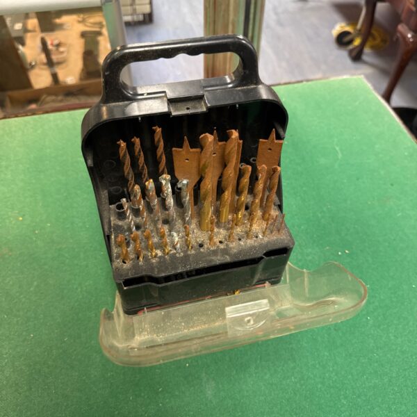 Rusty Black & Decker titanium drill bit set in storage case.