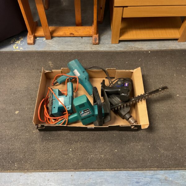 Vintage Black and Decker garden tools lot including hedge trimmer and paint stripper.