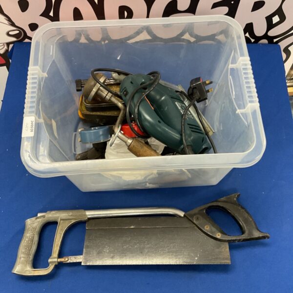 Black & Decker jigsaw within a tool lot, ideal for DIY projects.