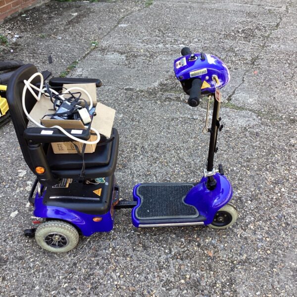 Blue electric mobility scooter in used condition.