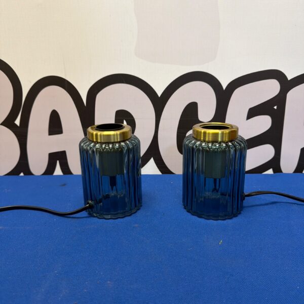 Blue ribbed glass table lamp with brass effect base.