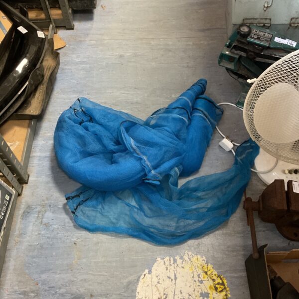 Blue heavy duty safety netting for construction or garden use.