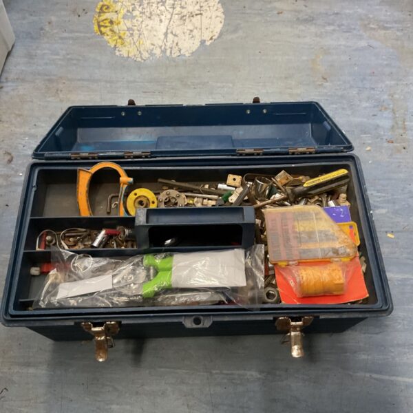 Blue plastic tool box filled with various hand tools.