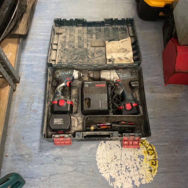 Open Bosch 14.4v cordless drill set with tools inside.