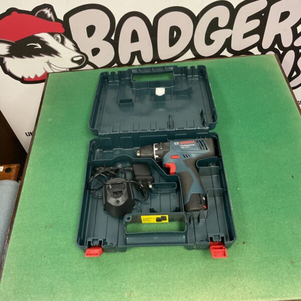 Bosch power drill in open case with battery and bits.