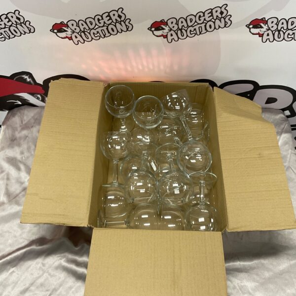 Box containing a collection of small wine glasses.