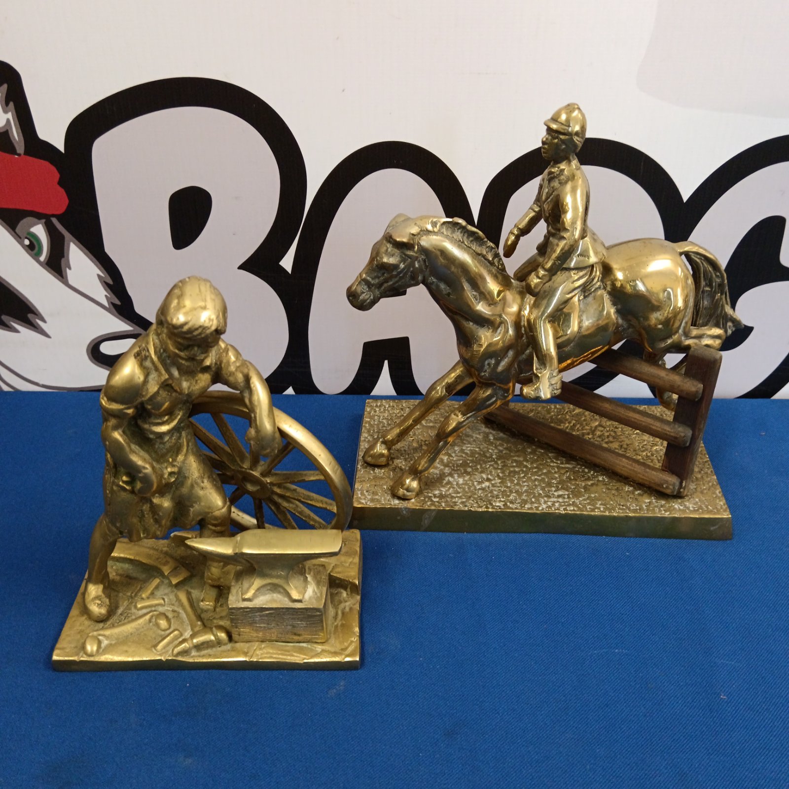 Vintage brass horse and jockey sculpture with blacksmith figurine.