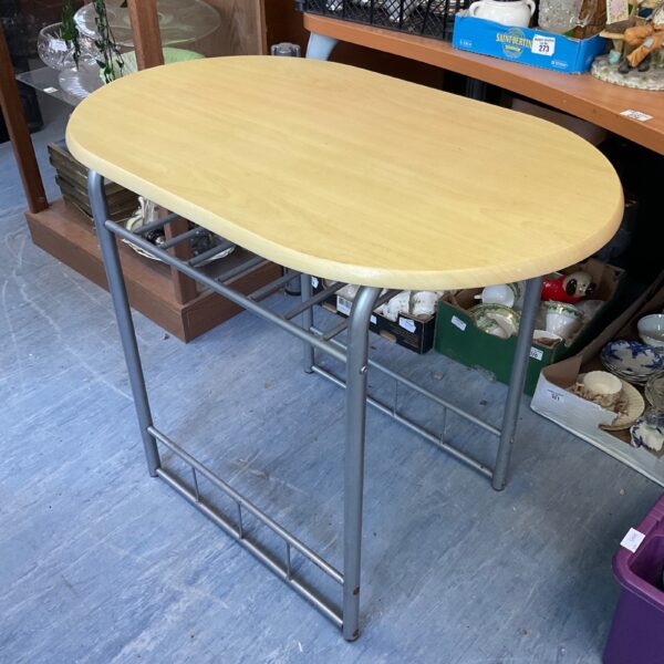 Metal framed breakfast bar table in a kitchen setting.