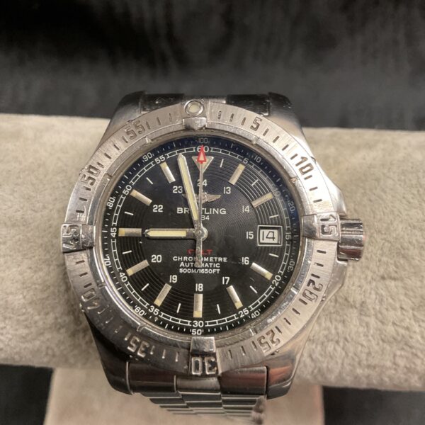 Vintage Breitling Chronomat automatic watch with black dial.