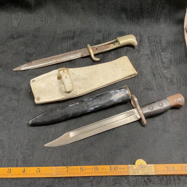 Vintage British bayonet with scabbard and ceremonial frog.