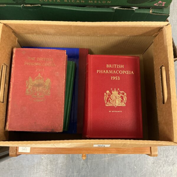 Vintage 1953 British Pharmacopoeia book cover in red.
