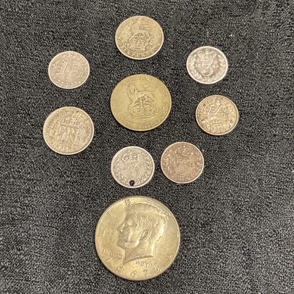 British silver coin collection featuring sixpences, shillings and florins.