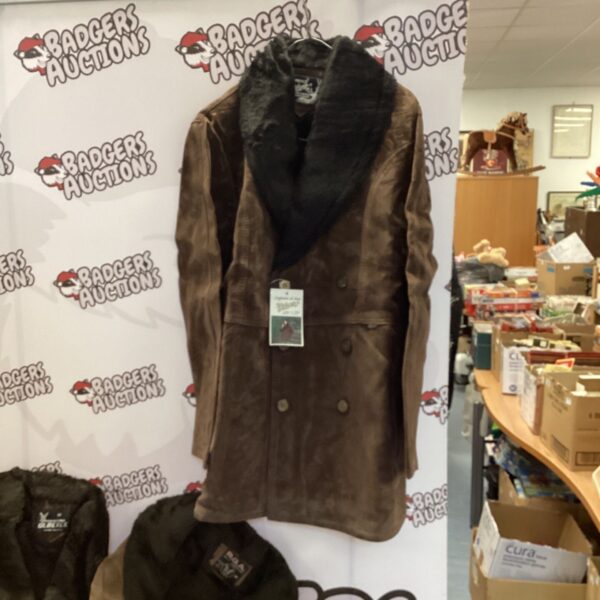Vintage brown suede coat with a luxurious fur collar on display.