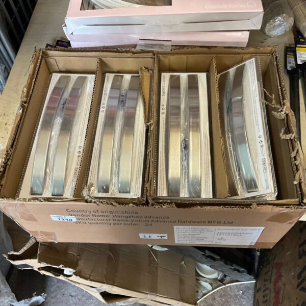 Box of 24 brushed nickel bow handles for cabinet hardware.