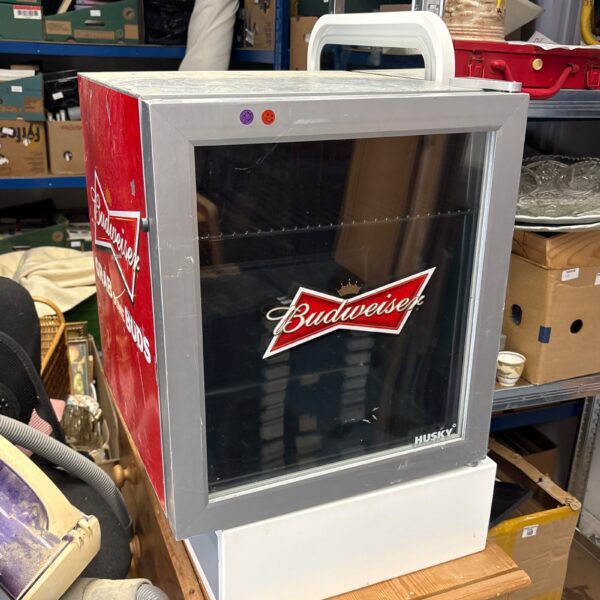 Vintage Budweiser mini fridge for beer and collectibles.