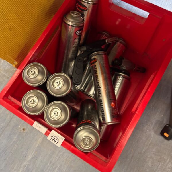 Red case filled with butane canisters for blow lamps.