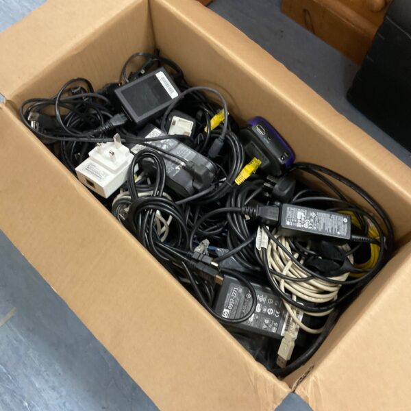 Assorted cables and power supplies in a mixed lot for vintage electronics.