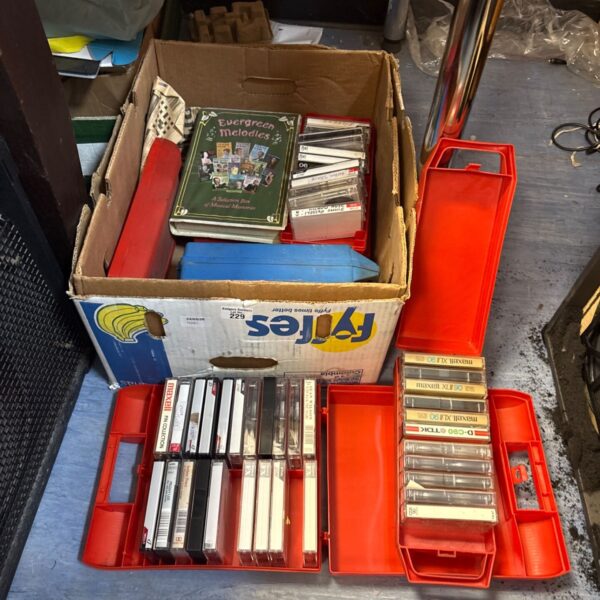 Vintage cassette tape cases lot for collectors and retro audio fans.