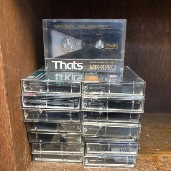 Vintage cassette tape labelled MRX90, part of a pre-recorded music lot.